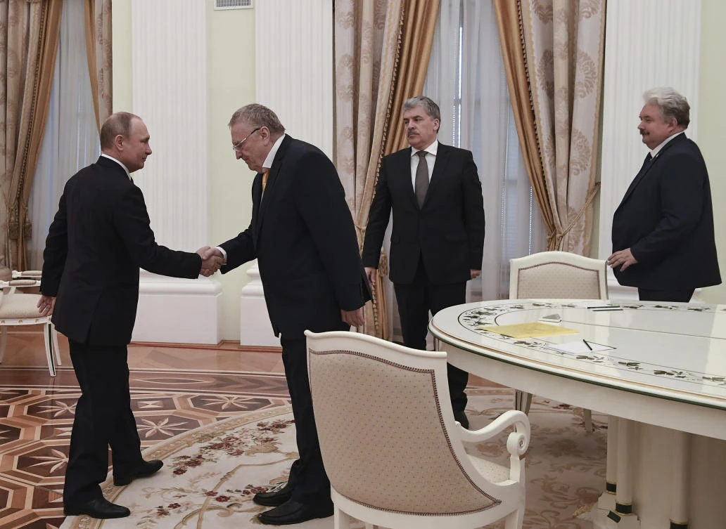 Russian President Vladimir Putin, left, shaking hands with opposition candidates who ran against him in yesterday's presidential election, notably Vladimir Zhirinovsky, and with Pavel Grudinin, 2nd right, and Sergei Baburin, right, at the Kremlin in Moscow, on March 19, 2018. (Yuri Kadobnov/Pool Photo via AP)