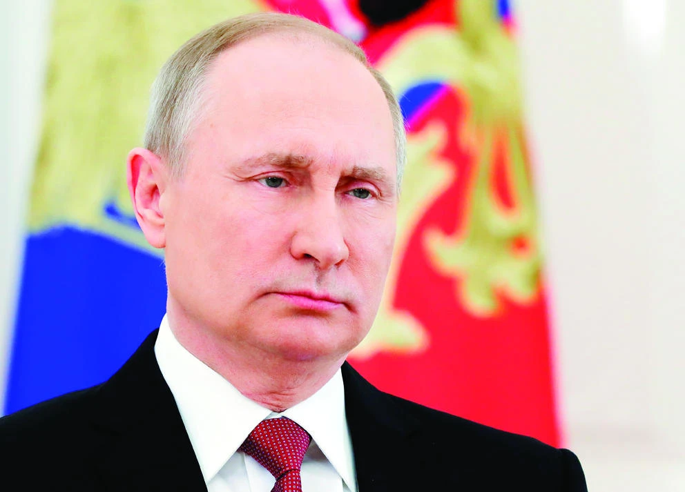 Russian President Vladimir Putin speaks during a live televised speech in Moscow, on Friday. (AP)