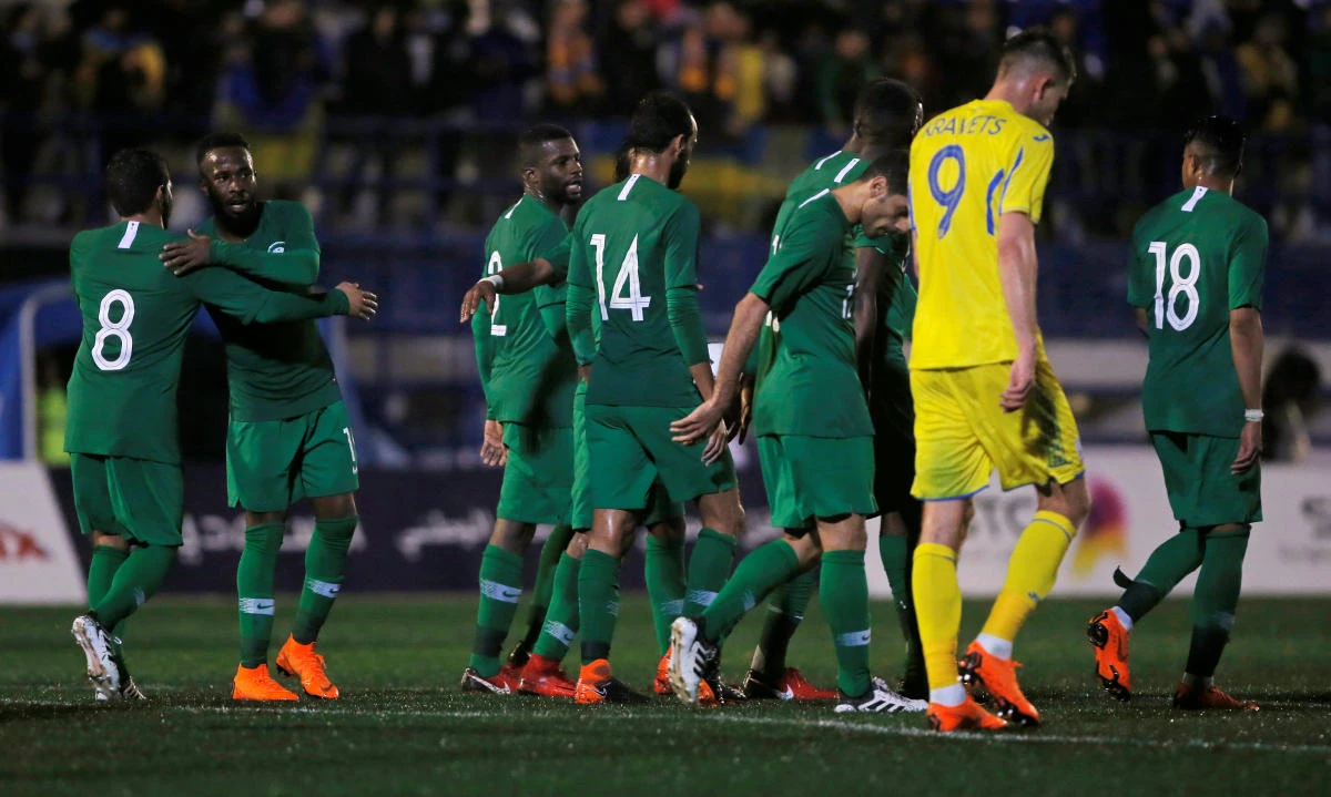 Saudi Arabia celebrate scoring the equalizing goal through Fahad Al-Muwallad. (Reuters)