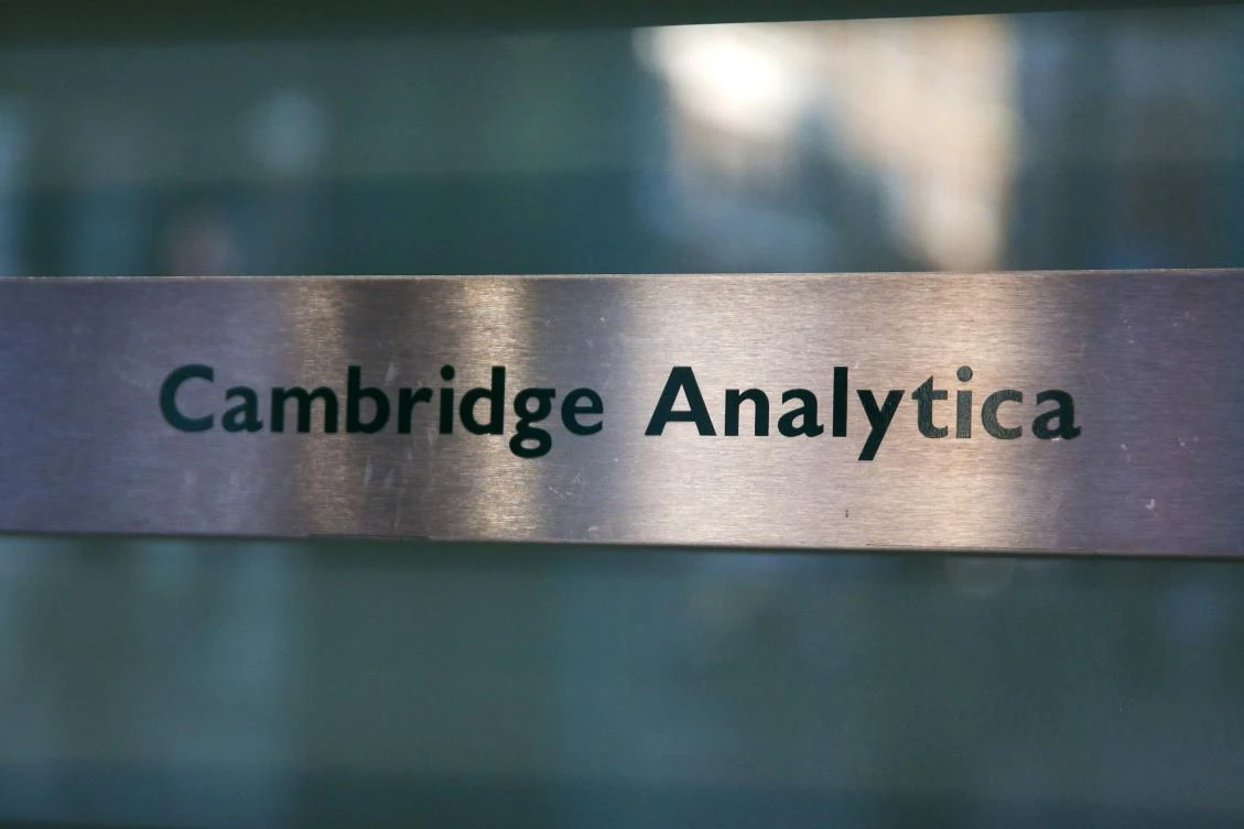 A Cambridge Analytica sign is pictured at the entrance of the building which houses the offices of Cambridge Analytica, in central London on March 21, 2018. Facebook expressed outrage over the misuse of its data as Cambridge Analytica, the British firm at the center of a major scandal rocking the social media giant, suspended its chief executive. (AFP/Daniel Leal-Olivas)