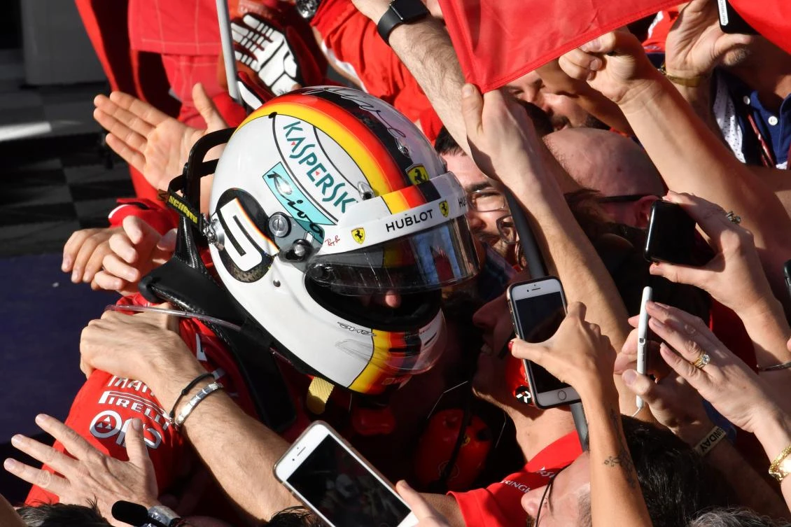 Ferrari’s German driver Sebastian Vettel celebrates winning the Formula One Australian Grand Prix in Melbourne on March 25, 2018. (Saeed Khan/AFP)
