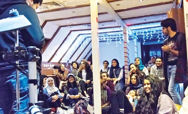 A group of young literature enthusiast gathered on Saturday morning in Humming Tree,a modern co-working space in Jeddah, to write about what the word ‘Motherland’ meantto them. (AN photo)