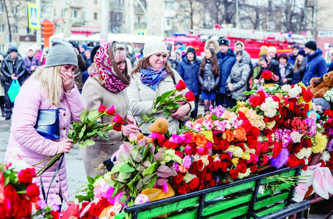 Putin, amid emotional scenes at fatal fire scene, pledges action as anger mounts