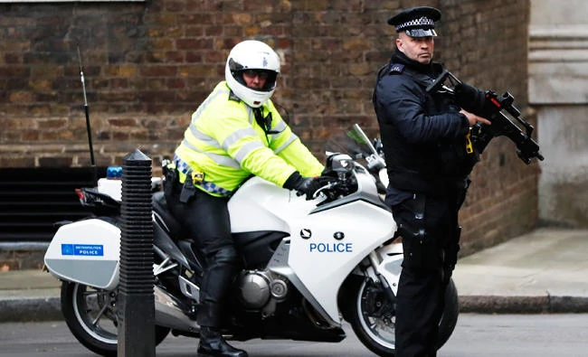 Police officers keep guard at Downing Street in London, in this Dec. 6, 2017 file photo. (AP)