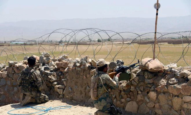 In this file photo, Afghan border police personnel keep watch during an ongoing battle between Pakistani and Afghan border forces near the Durand line at Spin Boldak, in southern Kandahar province on May 5, 2017. (AFP)