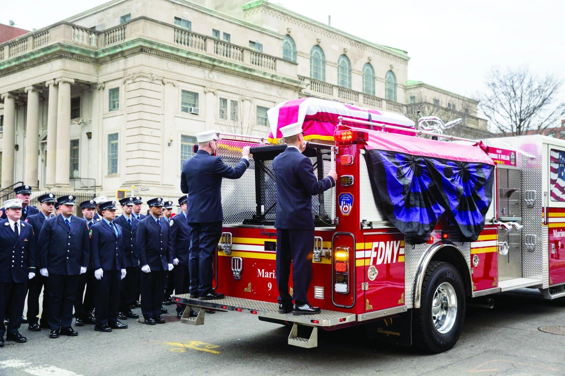 Members of the New York City fire department (FDNY) escort the casket of firefighter Thomas Phelan to St. Michael's Church in the boroughof Brooklyn. Phelan worked as a Statue of Liberty ferry boat captain, helping evacuate thousands of stranded citizens from Lower Manhattan during the 9/11 attacks. (AFP)