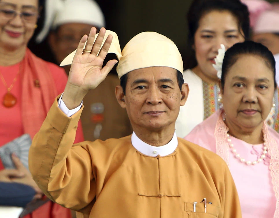 Myanmar's new President Win Myint waves to the media after taking oath of office at Parliament in Naypyitaw, Myanmar, Friday, March 30, 2018. (AP)