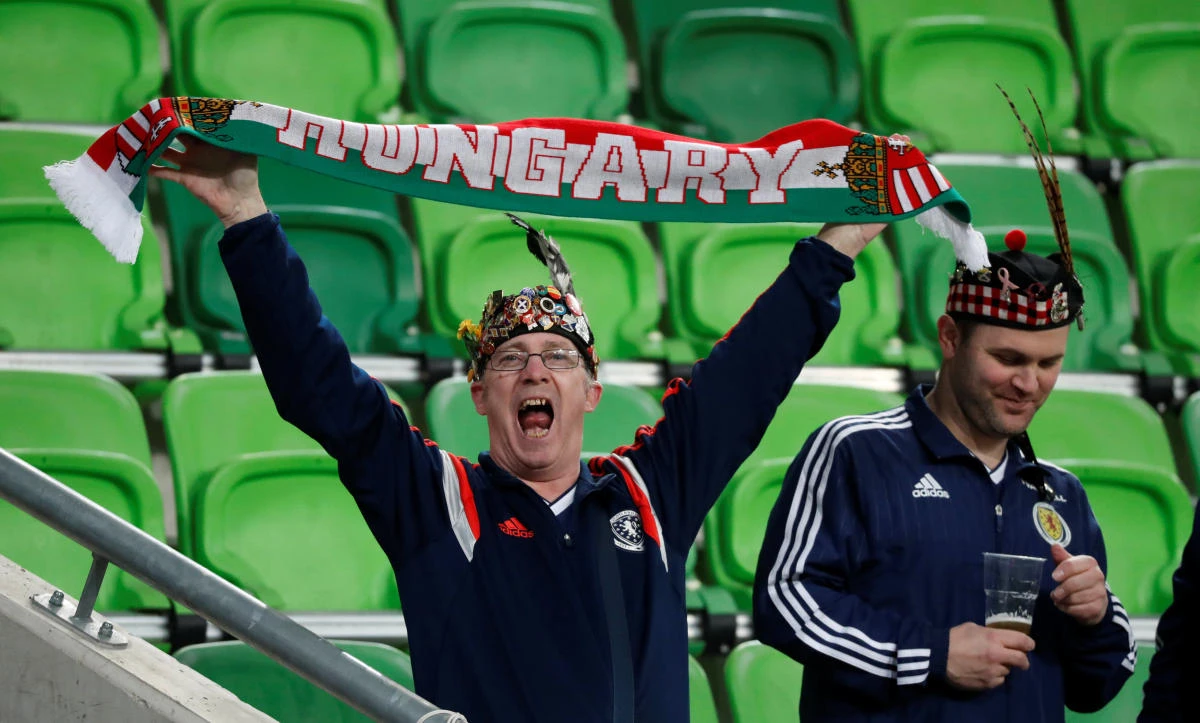 Hungary and Scotland fans stand side by side at Hampden Park this week. They could be united in their disappointment at how far their team's fortunes have nosedived. (Reuters)