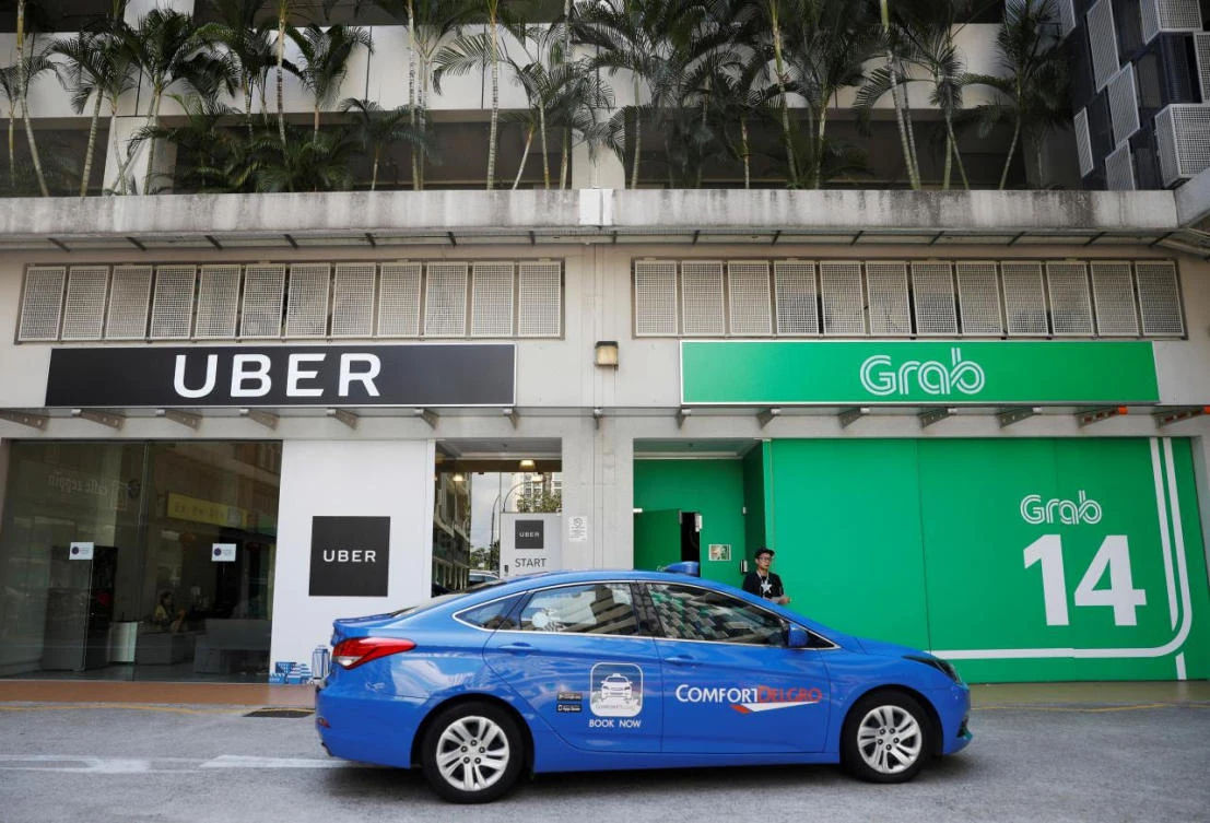Singapore’s Uber and Grab offices, where authorities have launched an investigation. (Reuters)