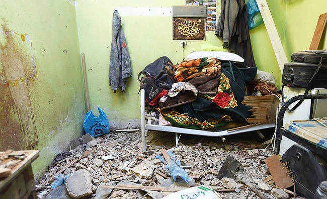A photo taken on March 26, 2018 in Um Al-Hammam district in Riyadh shows damages at a home hit by falling shrapnel from Yemeni rebel missiles that were intercepted over the Saudi capital. (AFP)
