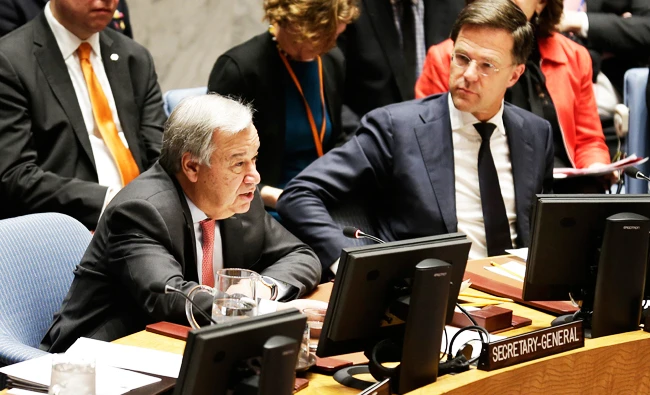 Dutch Prime Minister Mark Rutte, right, listens to United Nations Secretary-General Antonio Guterres speak during a Security Council meeting at UN headquarters, in this March 28, 2018 photo. (AP)