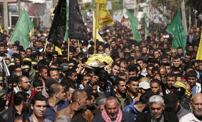 Thousands gather in Gaza for funerals of shot protesters