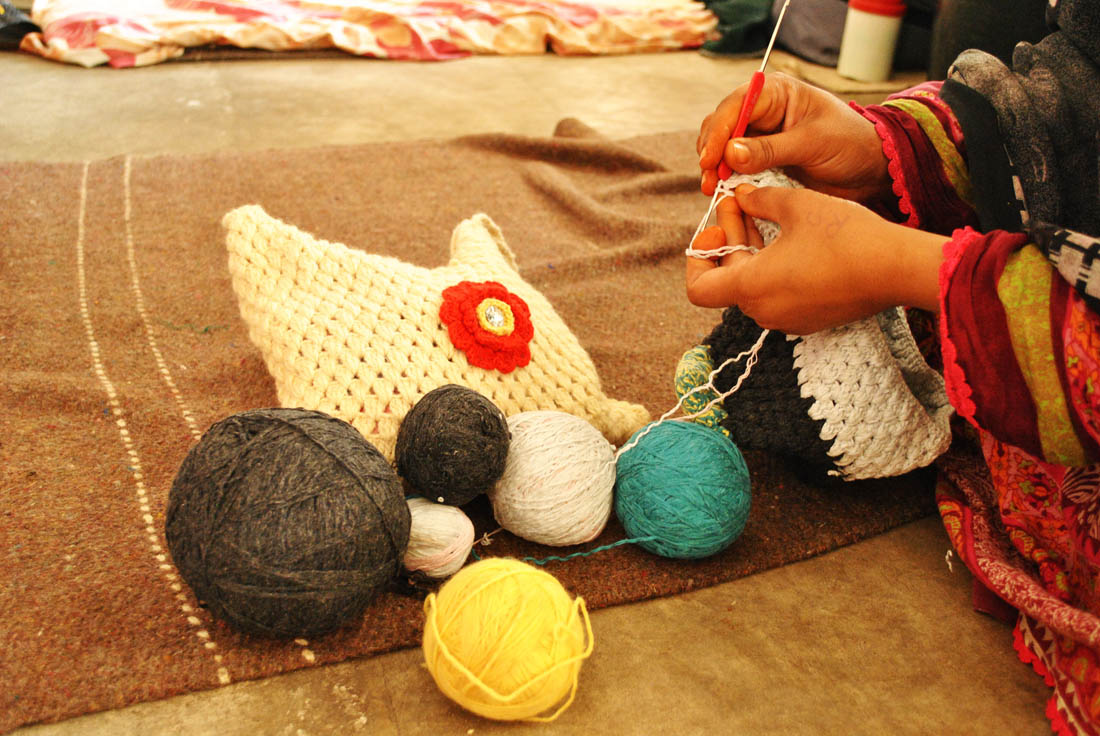 Woman prisoner lady is busy knitting caps for children. (AN photo by Saba Rehman)