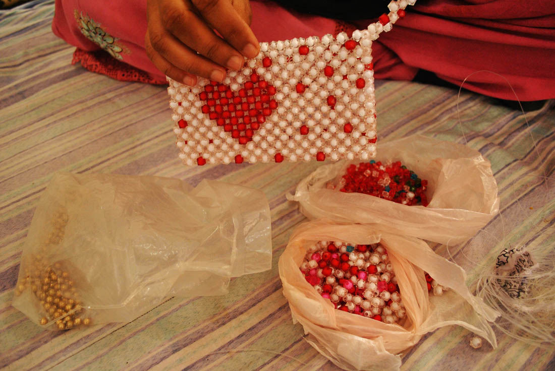 Woman prisoner is about to start her handicraft work with beats. (AN photo by Saba Rehman)