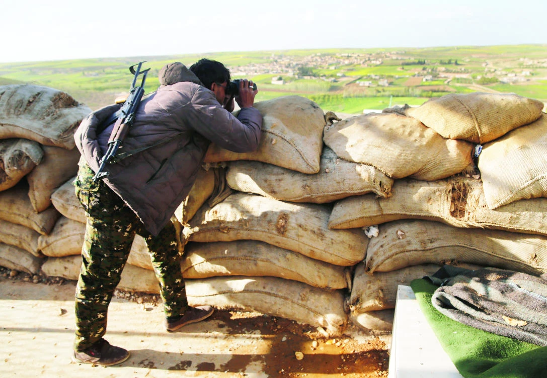 The front line of Halawanji village, north of Manbij town in Syria, was tense on Friday as Turkey threatened to advance on the town to clear it of the US-backed fighters. (AP)