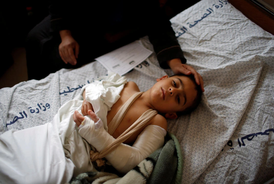 A Palestinian boy who was wounded at the Israel-Gaza border reacts at al-Shifa hospital in Gaza City April 1, 2018. (Reuters)
