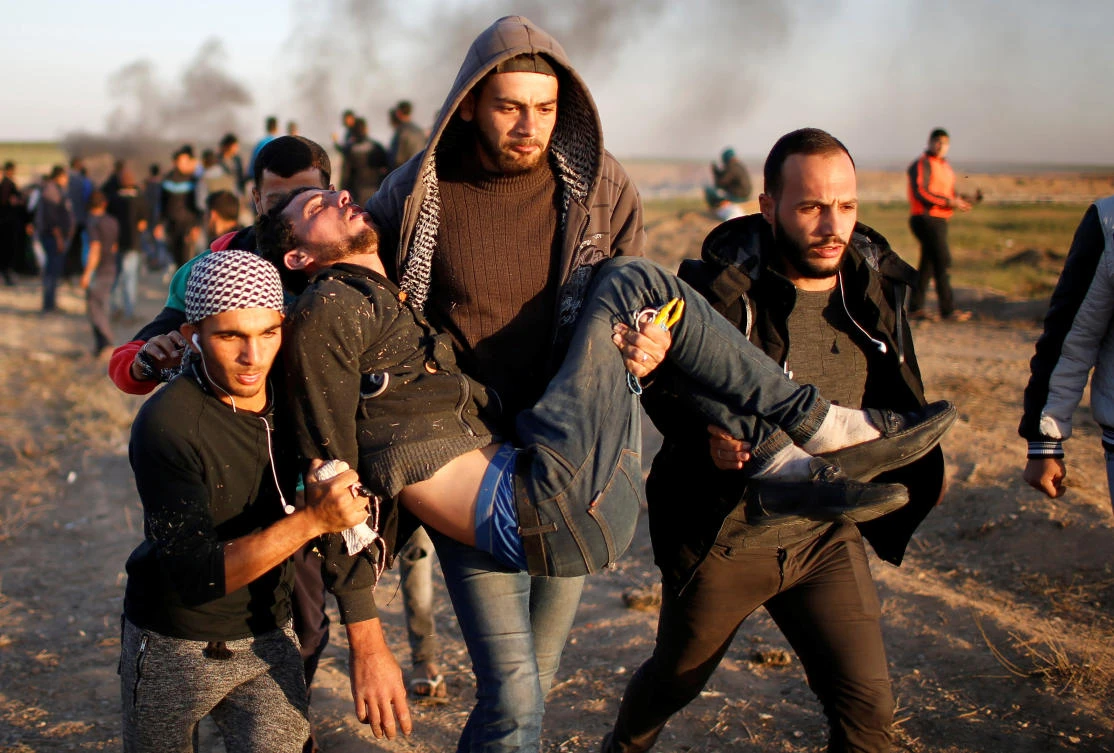 A wounded Palestinian is evacuated during clashes with Israeli troops at a protest, at the Israel-Gaza border, demanding the right to return to their homeland, east of Gaza City April 1, 2018. (Reuters)