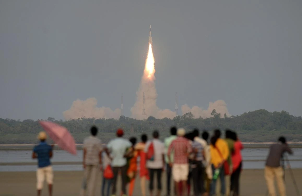 In this file photo taken on March 29, 2018, shows Indian onlookers watching as the Indian Space Research Organisation's (ISRO) GSAT-6A communications satellite launches on the Geosynchronous Satellite Launch Vehicle (GSLV-F08) from Sriharikota in the southern state of Andhra Pradesh. (AFP)