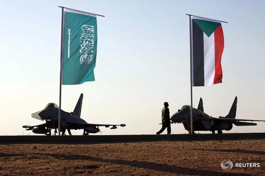 File photo showing a soldier walking past 2 Saudi Arabian air force fighter jets, Apr 2017. (Reuters)