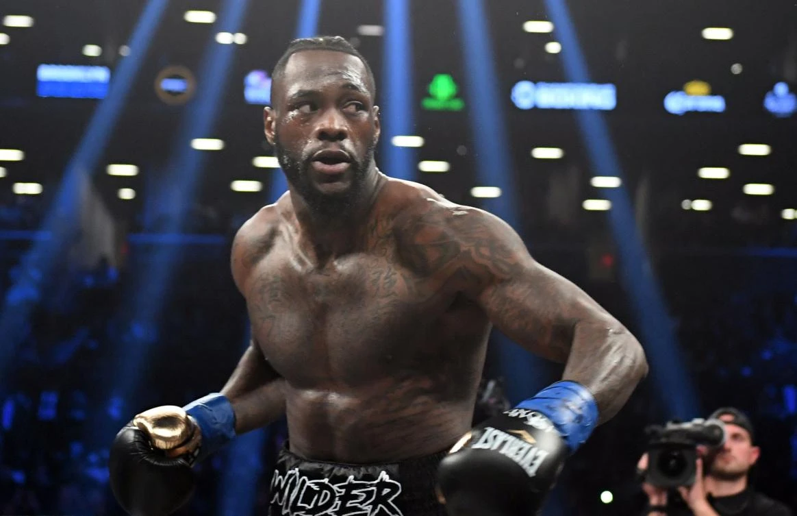 In this file photo taken on March 03, 2018 heavyweight champion Deontay Wilder of the US fights contender Luis Ortiz of Cuba (out of frame) during their WBC heavyweight title fight in New York. (AFP)
