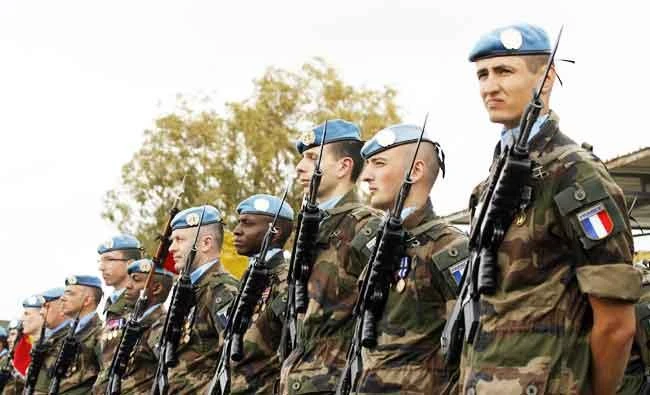 French soldiers from the Groupement Tactique Interarmes (GTIA), Force Commander Reserve (FCR) serving with the United Nations Interim Forces in Lebanon (UNIFIL) attend a medal award ceremony before being relieved by a new contingent in the Lebanese southern city of Deir Kifa on March 20, 2015. (AFP)