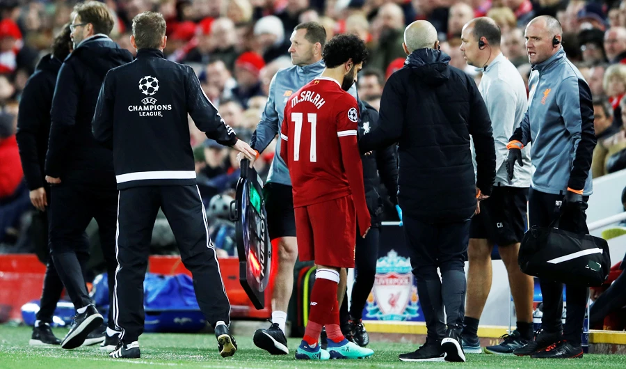 Liverpool's Mohamed Salah leaves the pitch as he is substituted after sustaining an injury. (Action Images via Reuters)