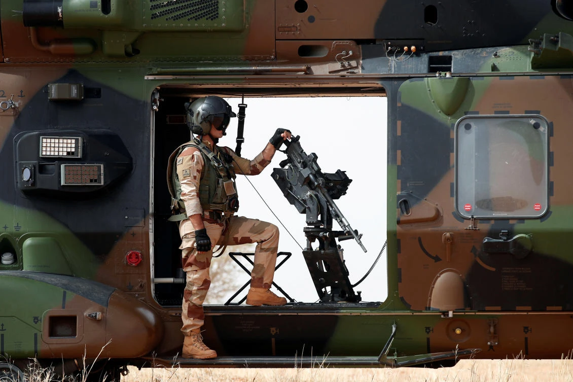 In this file photo, a French soldier stands by a mounted machine gun as he surveys the area during the regional anti-insurgent Operation Barkhane in Inaloglog, Mali. (Reuters)