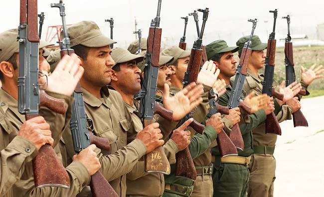 Syrian-Kurdish Peshmerga fighters and members of the Rojava Forces Defence Units take part in routine military exercises in the town of Faysh Khabur, which lies in Iraq's Kurdish autonomous region near the three-way border crossing between Iraq-Syria-Turkey on March 29, 2018. (AFP)
