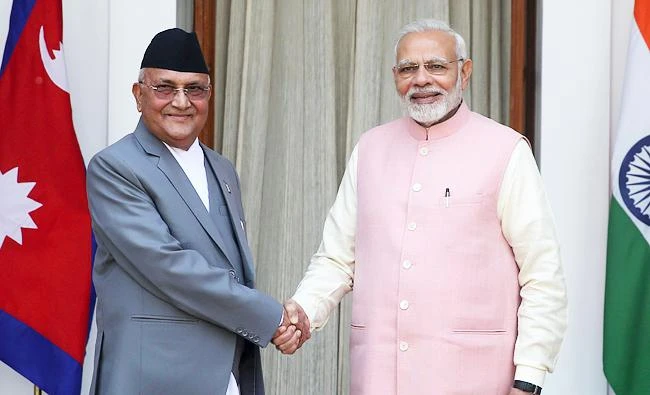 Indian Prime Minister Narendra Modi, right, shakes hand with Nepalese Prime Minister Khadga Prasad Oli as they arrive for a bilateral meeting at Hyderabad house in New Delhi, India, on April 7, 2018. (AP)