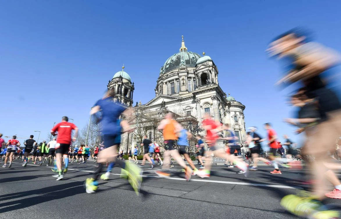 Athletes run past the Cathedral during the half-marathon in Berlin on April 8, 2018. (AFP)