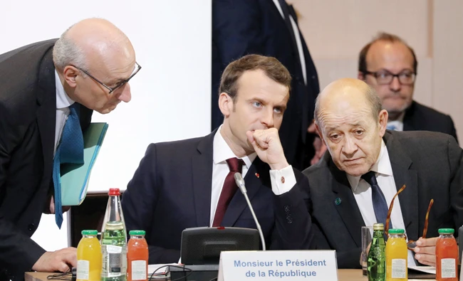 From left, presidential diplomatic advisor Philippe Etienne, French President Emmanuel Macron and French Foreign Affairs Minister Jean-Yves Le Drian attend the conference for international donors and investors to support Lebanon’s economy in Paris. Reuters