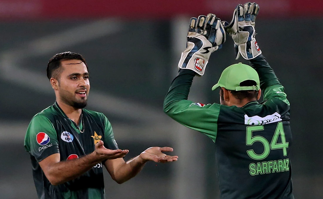 In this file photo, Pakistan's Faheem Ashraf, left, celebrates the dismissal of a West Indian batsman with skipper Sarfraz Ahmed, in Karachi, Pakistan on April 3, 2018. (AP)