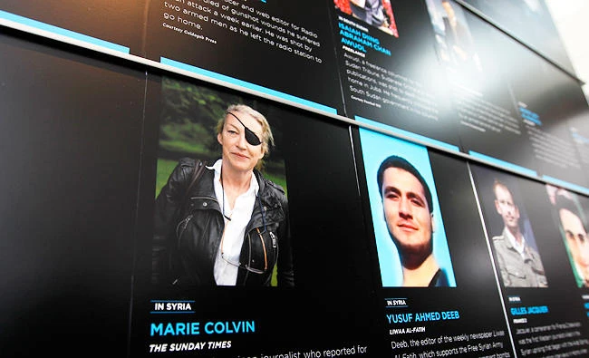 In this May 13, 2013, file photo, the photo of Journalist Marie Colvin who was killed in Syria while she was reporting from there, is seen on the wall of the Newseum during the Journalist Memorial Re-dedication ceremony of the journalists who died reporting the news in 2012 in Washington. (AP)