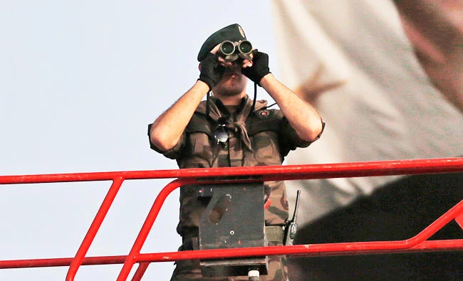 In this file photo, a Turkish police officer uses binoculars to scan the area from a platform, in Istanbul. (AP)