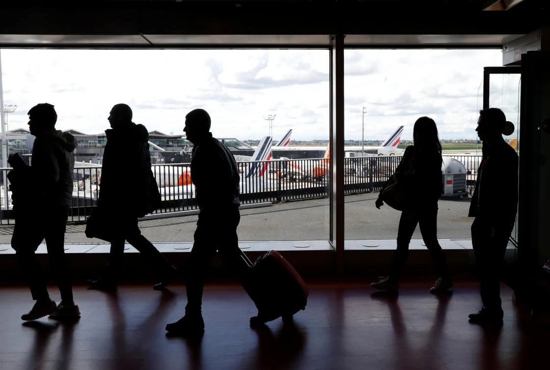 Passengers walk as Air France planes are parked on the tarmac at Orly Airport near Paris as the airline’s pilots, cabin and ground crews stopped working over salaries. (Reuters)