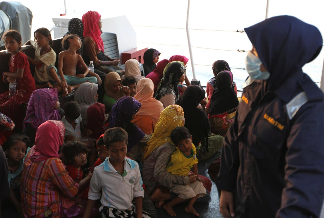 Rohingya refugees who were intercepted by Malaysian Maritime Enforcement Agency off Langkawi island, wait to be escorted to immigration authorities, at the Kuala Kedah ferry jetty in Malaysia April 3, 2018. (Reuters)