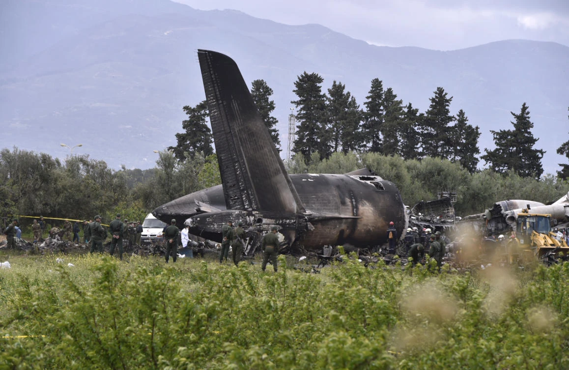 Photo showing rescuers around the wreckage of an Algerian army plane which crashed near the Boufarik airbase from where the plane had taken off on Apr 11, 2018. (AFP)