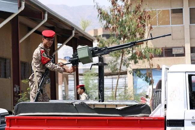 Yemeni military policemen patrol the streets of the city of Taiz, on March 13, 2018. (AFP)