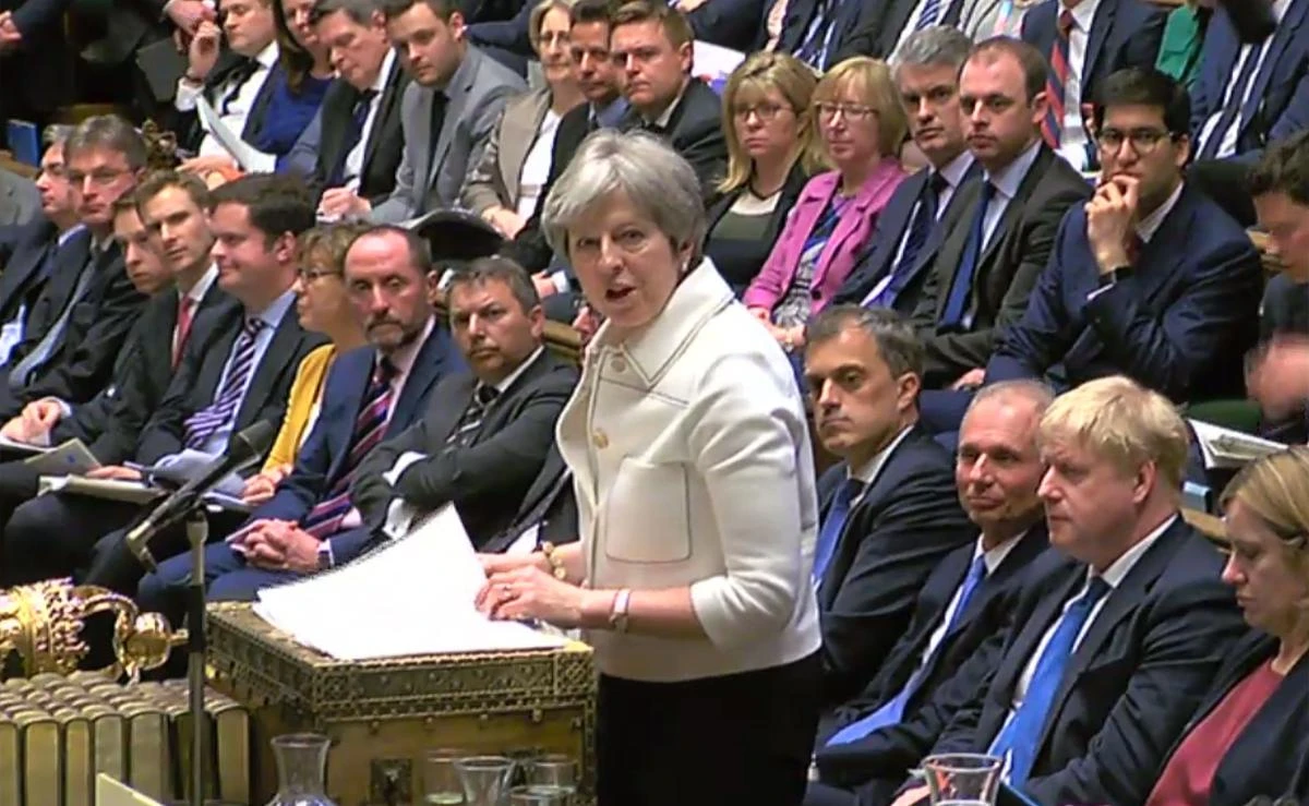 A video grab from the UK Parliament’s Parliamentary Recording Unit (PRU) shows Britain’s Prime Minister Theresa May responding to questions concerning British participation in the air strikes on Syria. (AFP)