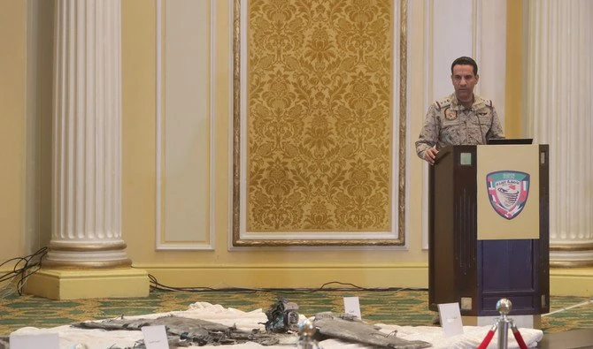 Col. Turki Al-Maliki, spokesman of the Saudi-led Coalition fighting Houthi rebels in Yemen, presents pictures of unmanned Iranian aircraft being used by the rebels to attack Saudi Arabia. (AN Photo: Essa Al-Doubisi, Bashear Saleh)