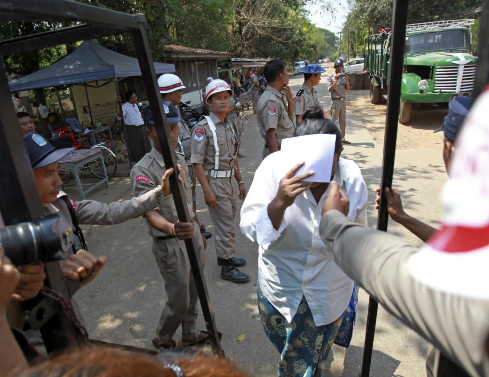 A released prisoner walks past the gate of Insein prison on Tuesday, April 17, in Yangon. Myanmar President Win Myint has granted amnesty to more than 8,500 prisoners, reportedly including at least three dozen political prisoners. (AP)