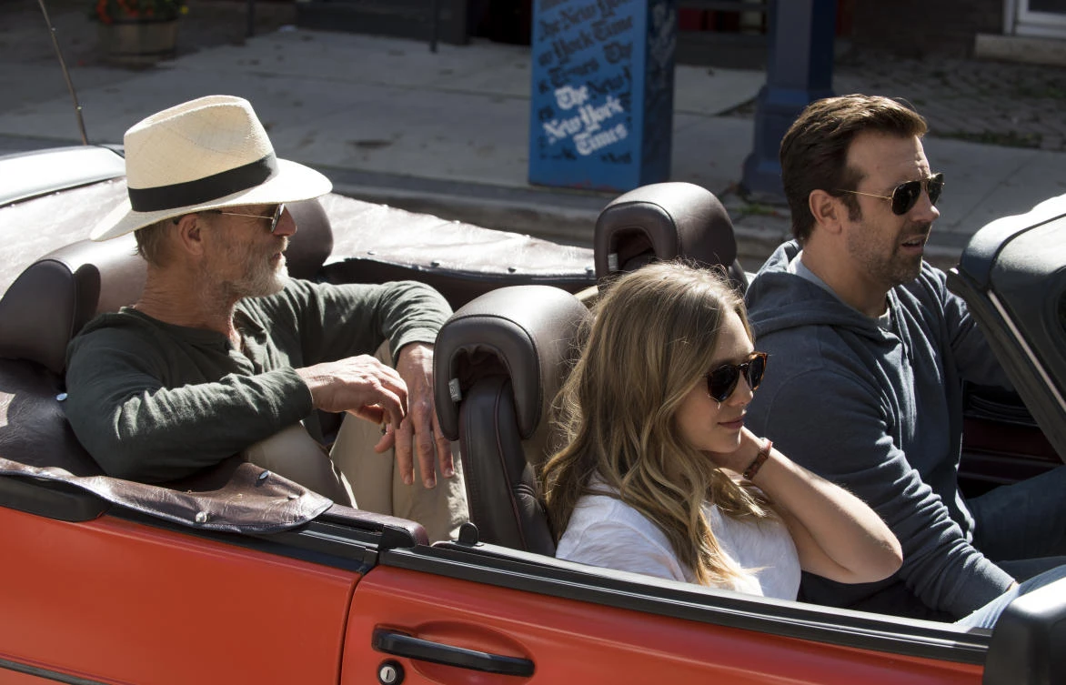 Ed Harris, left, Elizabeth Olsen and Jason Sudeikis in a scene from the Netflix distributed ‘Kodachrome.’ ( AP)