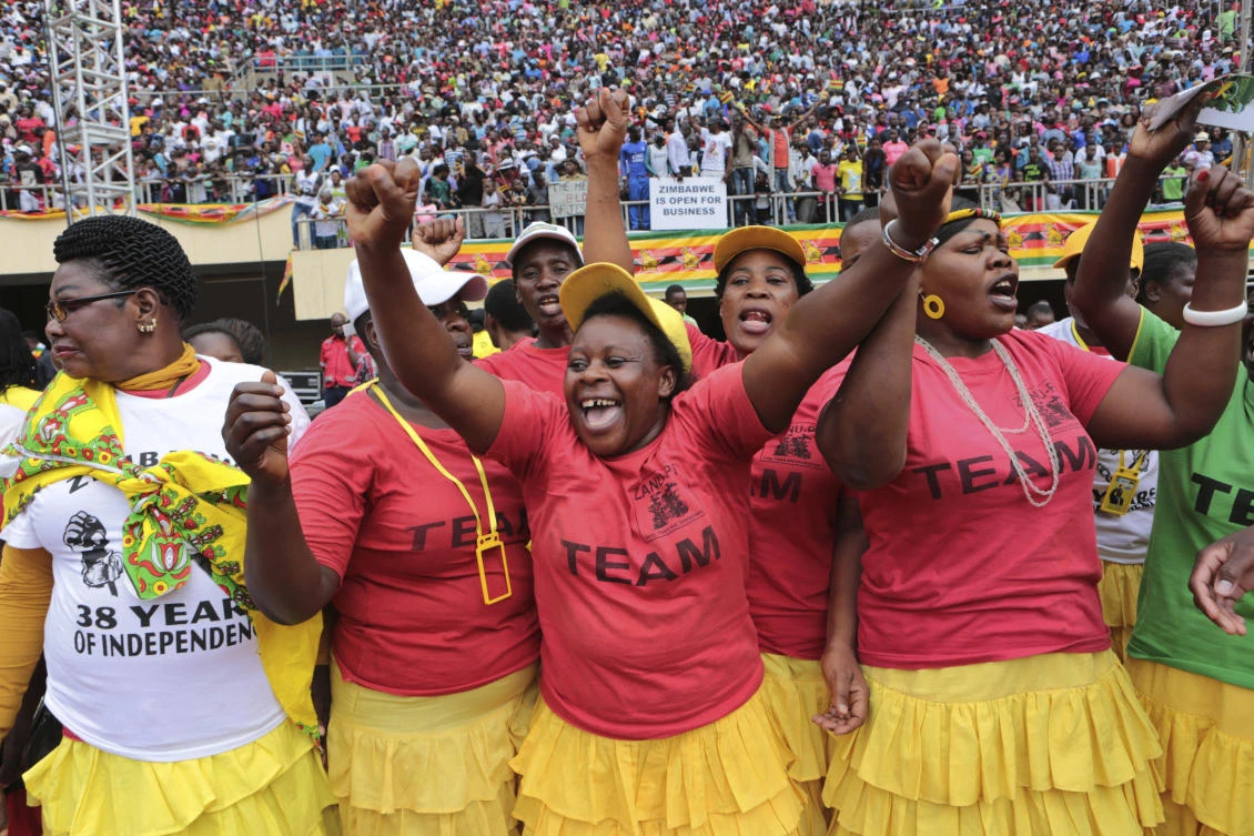 Supporters of Zimbabwe’s President Emmerson Mnangagwa sing and dance upon his arrival for the country’s 38th anniversary of Independence at the National Sports Stadium in Harare, Wednesday, April, 18, 2018. (AP/Tsvangirayi Mukwazhi)