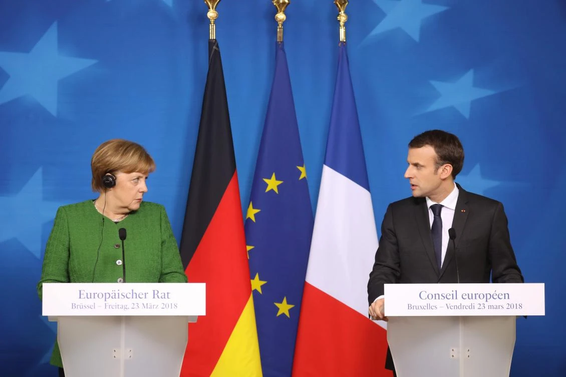 File photo showing French president Emmanuel Macron delivering a speech during a joint press conference with Germany’s Chancellor Angela Merkel on the second day of a summit of European Union leaders in Brussels, March 23, 2018. (AFP)