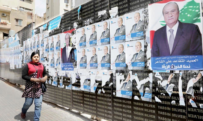 Campaign posters, for the upcoming Lebanese parliamentary election, hanging in the Tariq Jedideh district of Beirut, on April 3. (AFP)