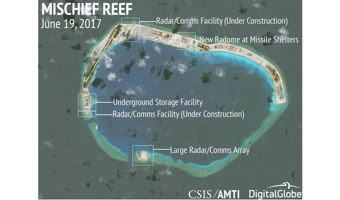 Philippines verifying photos of China military aircraft on disputed reef