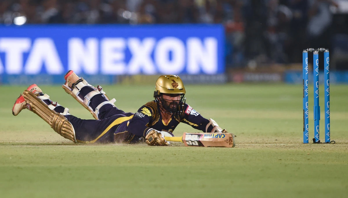 This file photo shows Kolkata Knight Riders’ captain Dinesh Karthik as he dives during the 2018 Indian Premier League (IPL) Twenty20 cricket match between Rajasthan Royals and Kolkata Knight Riders at the Sawai Mansingh Stadium in Jaipur on April 18, 2018 (Money Sharma/AFP)