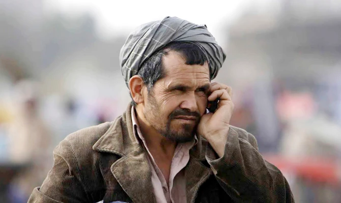 An Afghan talks on his mobile phone in Kabul. Taliban insurgents recently shut down private telecommunication companies in several parts of the country. (Reuters)