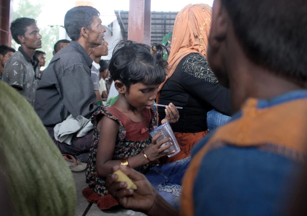 A group of Rohingya refugees rest at a temporary shelter after landing in Aceh province on Sumatra island on April 20, 2018. (AFP)