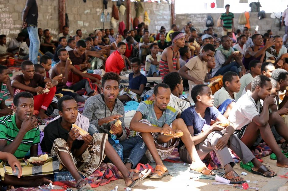 African migrants sit in a deportation center in Aden, Yemen March 17, 2018. Picture taken March 17, 2018. (Reuters)